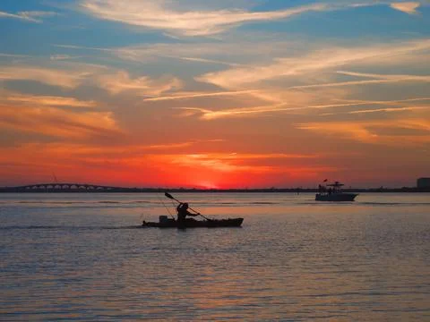 Kayaking at sunset Stock Photos