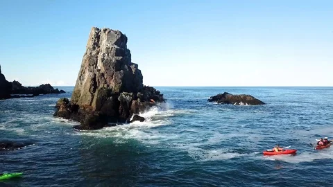 Kayaking thought the cliffs of Kekurny cape Stock Footage 91541775