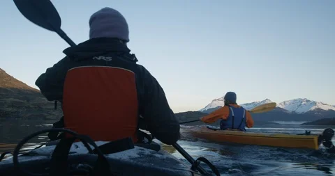 Kayaking with two people on calm mountain lake Stock Footage 90404794