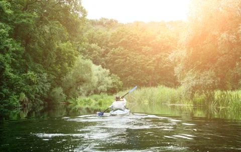 Kayaking under fallen tree Stock-Fotos