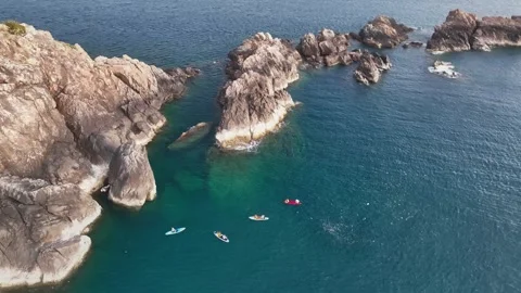 Kayaks and paddleboards at Eo Gio cliffs, Quy Nhon, Binh Dinh, Vietnam Stock Footage 337891505