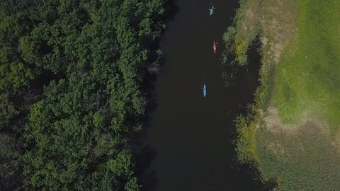 Kayaks float on the river Stock Footage 110734740