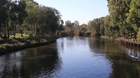 Kayaks float on the river yarkon .tel aviv. israel Stock Footage 43014117