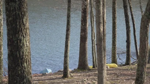 Kayaks by the lake 1 100mbs Stock Footage