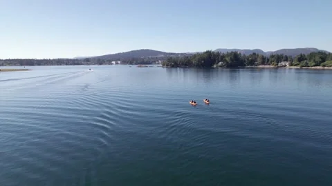 Kayaks on the ocean, sunny day, drone footage, Sooke BC, relaxing ocean scene Stock Footage 204102353