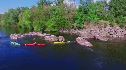 Kayaks, pitfalls, current. Quadrocopter over the river three kayaks Stock Footage 82663177