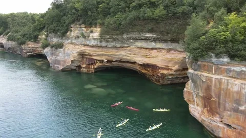 Kayaks Under Pictured Rocks Munising Michigan Drone Shot of Cliffs Stock Footage 154131007