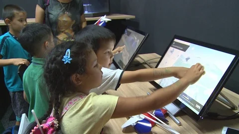 Kazakh children touching interactive computer screen Stock Footage 78762203
