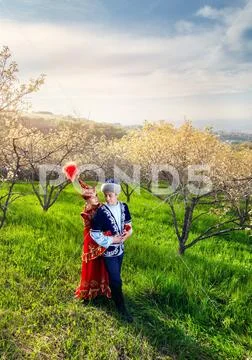 Kazakh couple in ethnic costume Stock Photos