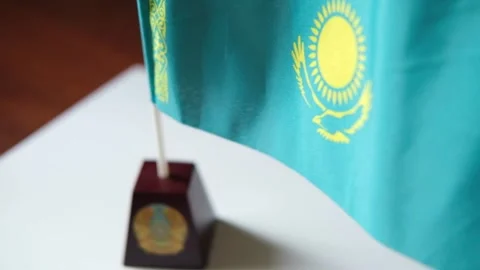 Kazakhstan Wavy Flag on the table in the office. Stock Footage 313108297