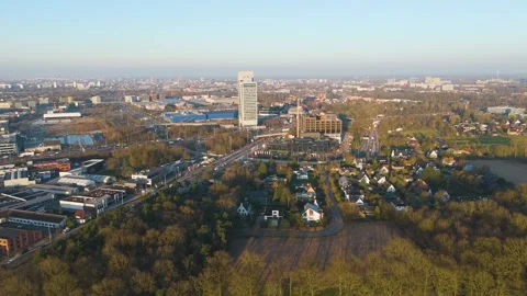 Kbc tower rises amid highways office complexes construction cranes suburban Stock Footage 329085844