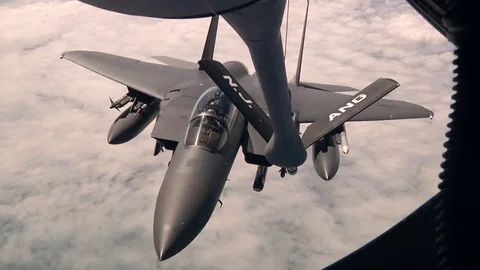 KC-135 begins the refuel process for an F-15E during Air Refueling Mission -2015 Stock Footage 99981478