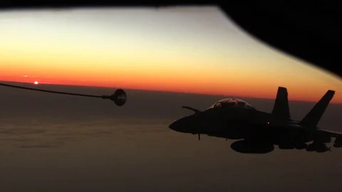KC-135 jet refueling a flight of US Navy while flying - 2017 Stock Footage 84729935