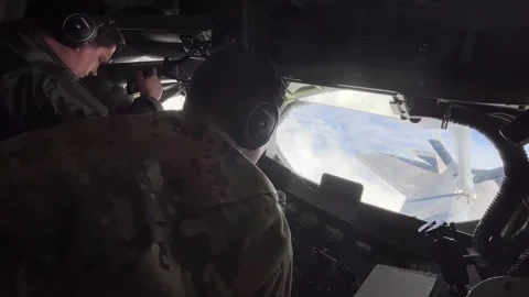 KC-135 Stratotanker boom operator refuels U.S. Air Force F-22 Raptor Stock Footage 278213673