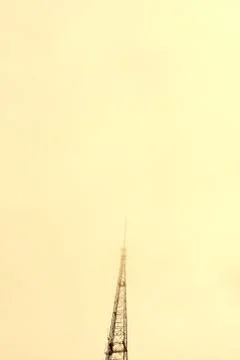 KCPTV transmitter tower against orange sky Stock Photos