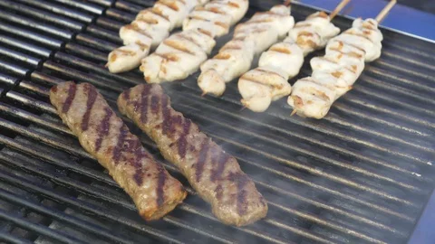 Kebab and chicken being cooked in the grill. Stock Footage 107956835
