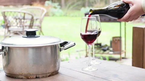 Kebab meat in a pot on a table with a built-in barbecue, dinner outdoors in a ga Stock Footage 274175944