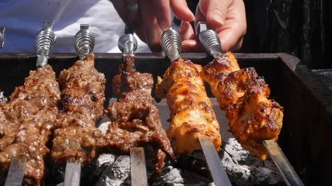Kebabs cooking on a BBQ Stock Footage 112004318