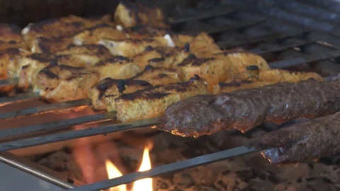 Kebabs cooking on a grill fire Stock Footage 87857467