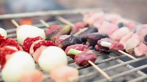 Kebabs cooking on grill Stock Footage 63305753
