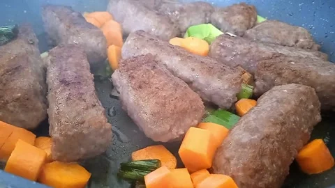 Kebabs grilling meat with vegetables, close up. Stock Footage 201361428