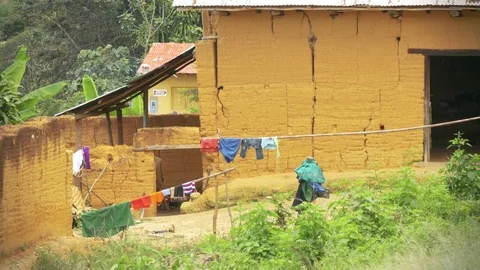 Kechwa Woman picking clothes while it rains in Peru Stock Footage 80463696