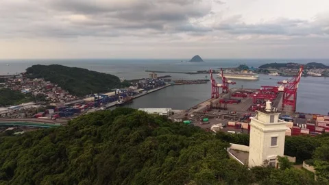 Keelung harbor lighthouse overlooking container terminal in taiwan Stockbeeldmateriaal 335862410