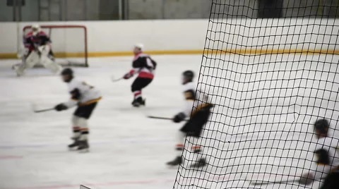 Keen fight between rival team players near net during important ice hockey match Video stock 63090160