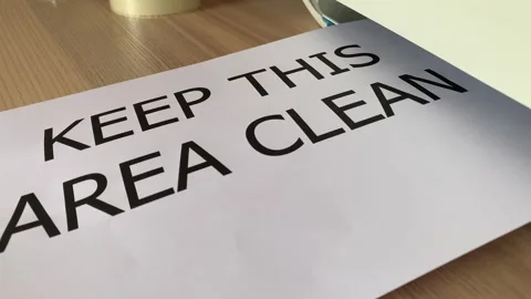 “Keep this area clean” black text word on paper sheet A4 Stock Footage 249576865