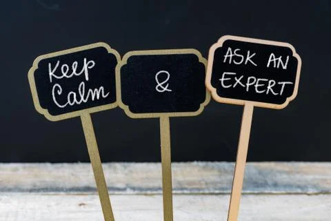 Keep Calm and Ask An Expert message written with chalk on mini blackboard lab Stock Photos