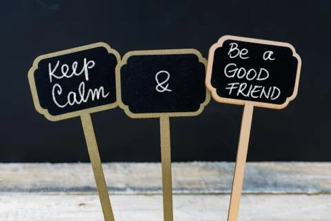 Keep Calm and Be A Good Friend message written with chalk on mini blackboard  Stock Photos
