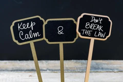 Keep Calm and Do Not Break The Law message written with chalk on mini blackbo Stock Photos
