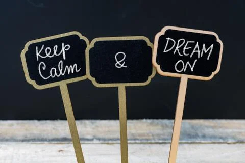 Keep Calm and Dream On message written with chalk on mini blackboard labels Stock Photos