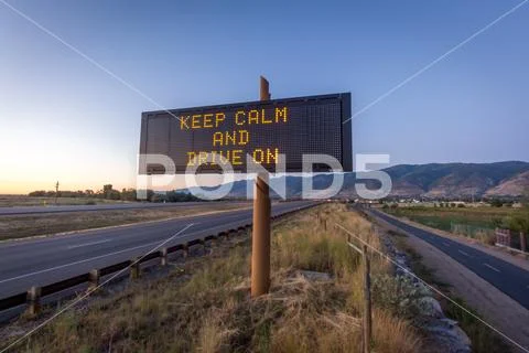 Keep Calm and Drive On Road Sign Stock Photos