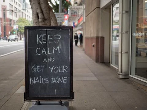 Keep calm and get your nails done street sign Stock Photos