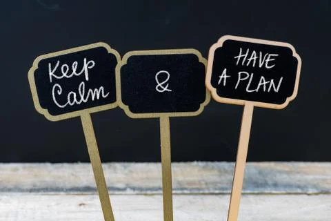Keep Calm and Have A Plan message written with chalk on mini blackboard label Stock Photos