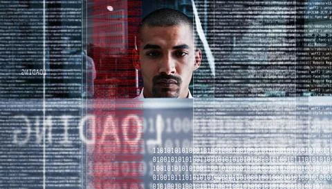 Keep calm and keep on coding. a young computer programmer looking through data. Stock Photos