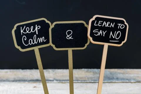 Keep Calm and Learn To Say NO message written with chalk on mini blackboard l Stock Photos
