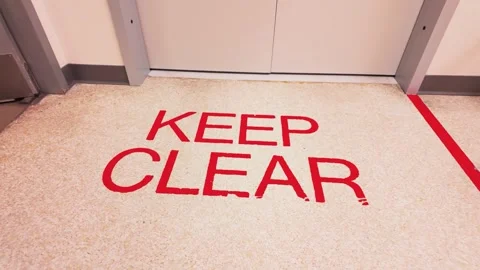 Keep clear red floor sign in front of hospital x-ray room Stock Footage 331712066