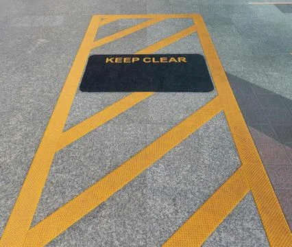 Keep clear sign at the sky train station Stock Photos