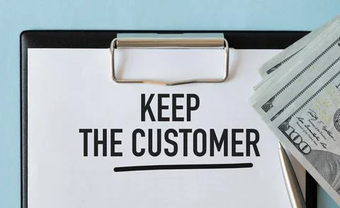 Keep the Customer. Blue background with notepad and money. text on white pape Stock Photos