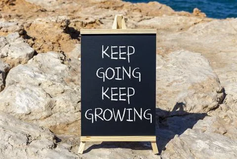 Keep going and growing symbol. Concept words phrase Keep going keep growing.. Foto stock