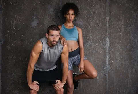 Keep going even when your backs against the wall. a sporty young couple resting Fotos Stock