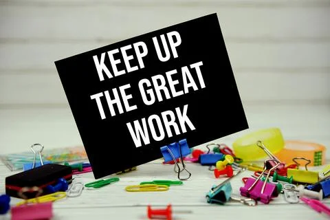 Keep Up The Great Work text on paper card with stationary on wooden backgroun Stock Photos