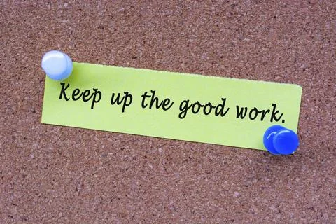 Keep up he good work words on stick note and pinned to a cork notice board. Stock Photos