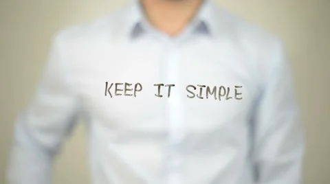 Keep it Simple,  Man writing on transparent screen Stock Footage 62983684