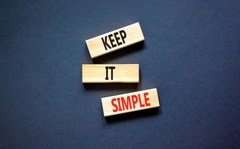 Keep it simple symbol. Concept word Keep it simple on beautiful wooden bloc.. Stock Photos