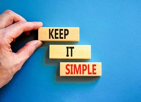 Keep it simple symbol. Concept word Keep it simple on beautiful wooden bloc.. Stock Photos