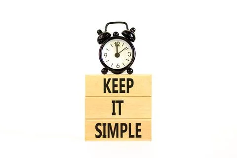 Keep it simple symbol. Concept word Keep it simple on beautiful wooden bloc.. Stock Photos