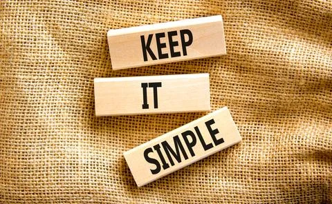Keep it simple symbol. Concept word Keep it simple on beautiful wooden bloc.. Stock Photos